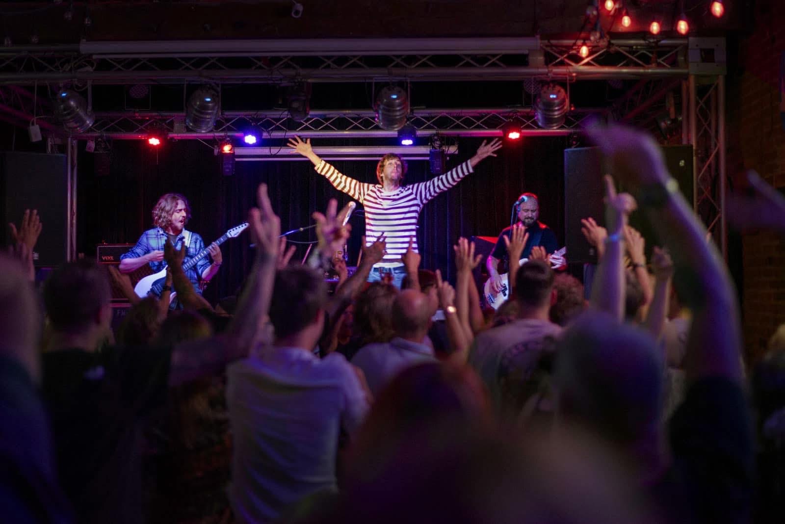 Francis performing to a packed crowd — energy and atmosphere